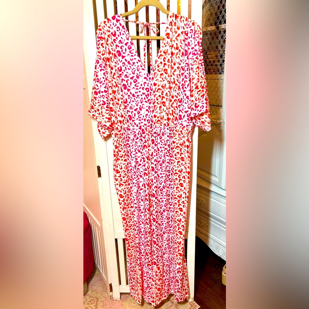 Really cute jumpsuit in shades of pink and orange NEVER WORN!!! NEW WITHOUT TAGS